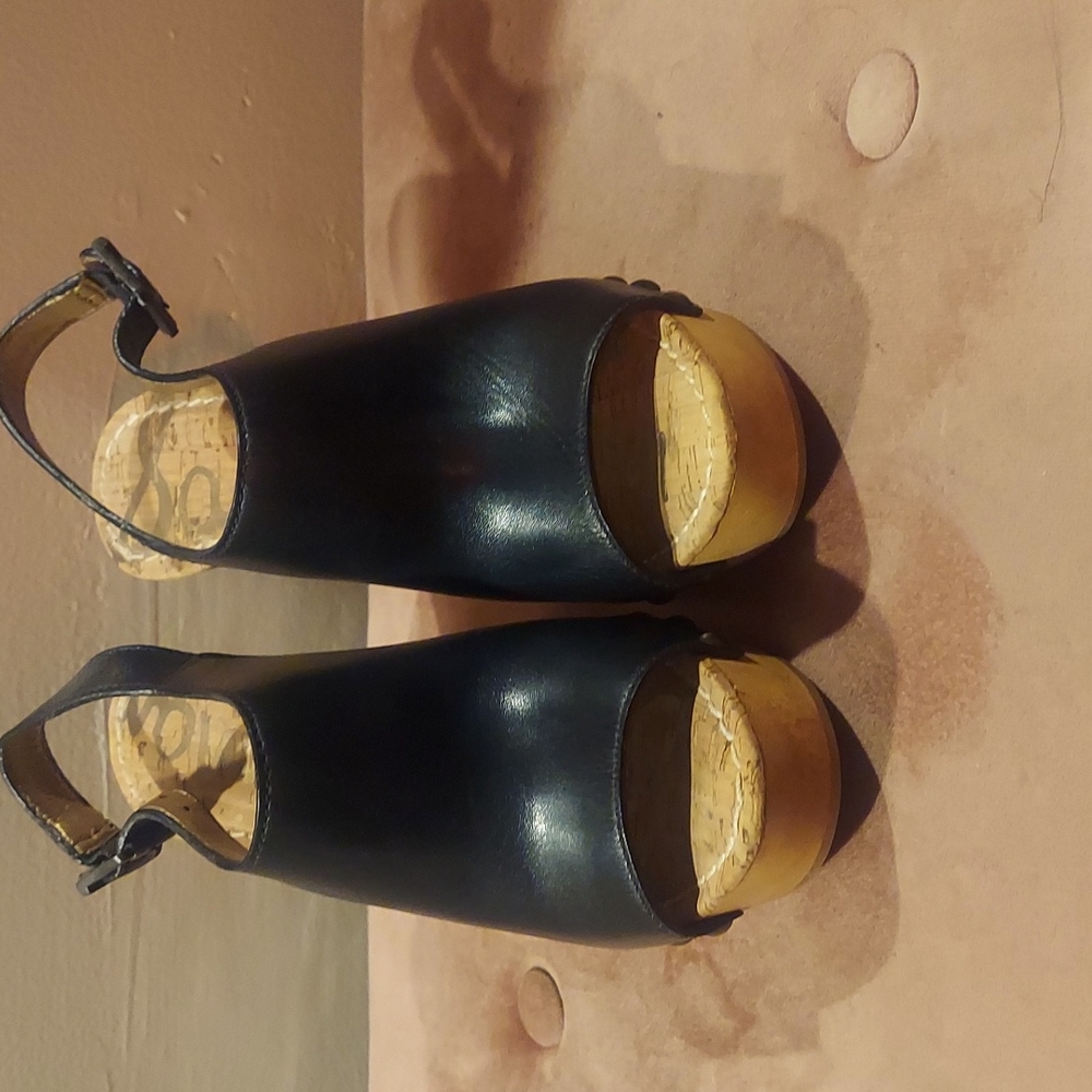 I am selling  a size 7/12 black and brown wedge sandal.